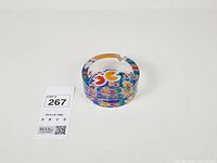 Overall view of glass ashtray showing pixel art design