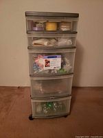 Front view of Sterilite five-drawer cart showing translucent drawers and contents