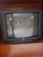 Front view of JVC CRT television showing screen and cabinet