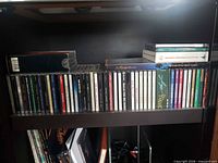 Shelf with long row of jewel case CDs