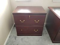 front and top view of cabinet showing overall condition and brass-tone hardware
