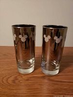 Both Disney etched glasses front view