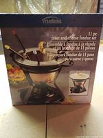 Front of boxed Trudeau 11-piece fondue set showing product image and components