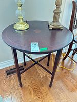Top view of round end table with lamp props