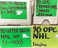 Labeled storage boxes listing sets and singles