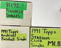 Labeled card storage boxes identifying card sets and years