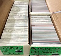 Two rows of boxed NFL Pro Set singles labeled 1991 and 1990