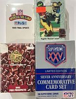Four boxed NFL trading card sets stacked