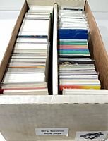 long storage box filled with two rows of trading cards