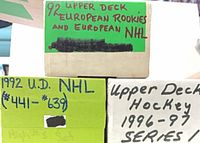 Cardboard storage boxes labelled 1992 European Rookies, 1992 Upper Deck #441-639, and 1996-97 Upper Deck Series One