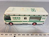 Left side view of Hess RV showing overall design and red wheels