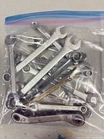 Bag containing full assortment of combination wrenches
