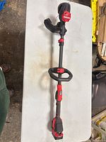 Full view of Craftsman cordless string trimmer with battery attached