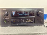 Front view of Denon AVR-4308CI showing display and controls