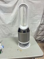 Full view of Dyson Pure tower air purifier fan on table