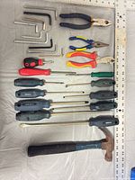 Full layout of all tools including screwdrivers, pliers, hex keys and hammer