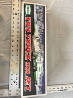 Front of box showing Hess Toy Truck and Jet graphics and length indicator