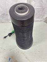 Front angled view of Honeywell tower air purifier showing overall shape and vent fins