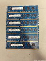Six blue Hynix DDR3 DIMMs laid out