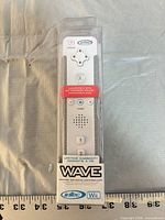 Front view of sealed controller packaging showing brand, model and color