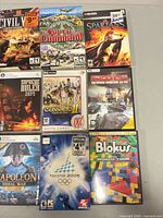 Front view showing nine game cases including Civil War, To Serve and Command, The Spartans, Supreme Ruler 2020, Cossacks II, Napoleon: Total War, Torino 2006, Blokus World Tour
