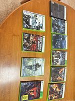 Front view of all 10 game cases arranged on table