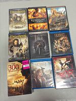 All nine disc cases laid out front covers visible