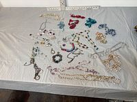 Overall view of entire jewellery lot laid on table