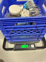 Crate of hardware on scale showing 26.4