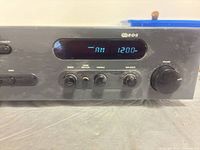 Front display showing AM 1200 and tone control knobs