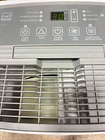 Top control panel showing digital display and vent grilles