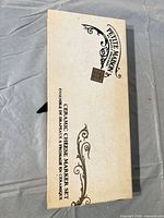 Front of Petite Maison Ceramic Cheese Marker Set box