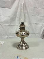 Front view showing complete lamp with chimney
