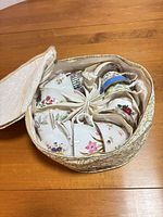 Top view of padded storage case holding multiple floral teacups