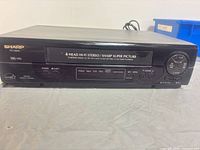 Front view of Sharp VC-H800 VCR showing controls and labels