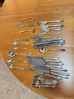 All flatware pieces laid out on table