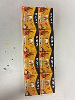 Front view of eight sealed Sony DVC Excellence MiniDV tapes aligned in two columns