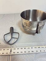 Bowl upright with flat beater and ruler for scale