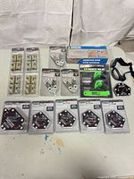 Entire lot laid out showing all packaged welding magnets, clamps, tool set, magnetic base, goggles