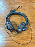 Headset laid flat showing ear cups, headband, cable and 3.5mm plug