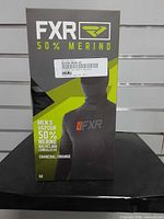 Front of FXR Vapour 50% Merino base layer retail box