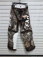 Full front view of FXR motocross pants on hanger
