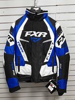 Full front view of FXR Team FX snowmobile jacket hanging