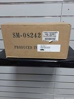 Closed box showing model code SM-08242