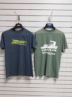 Front view of both T-shirts on hangers
