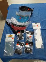 Overview of visors, lenses and hardware on table