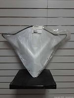 Front view of packaged white Polaris windshield