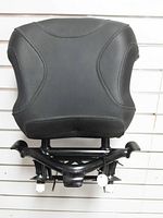 Front view of black passenger backrest cushion and frame