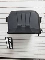 Front view of Polaris rack bag showing molded rigid top and side straps.