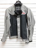 Front view of Polaris black/gray ORV riding jacket hanging, tags attached